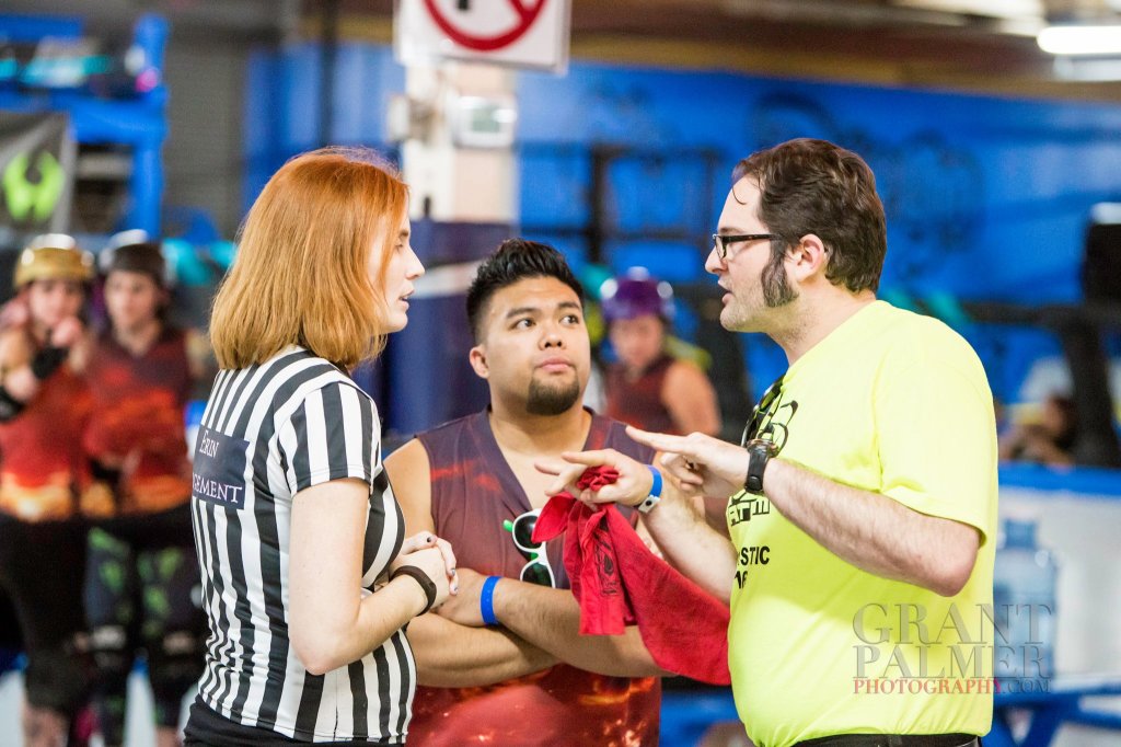 Coaches confer with the Head Referee