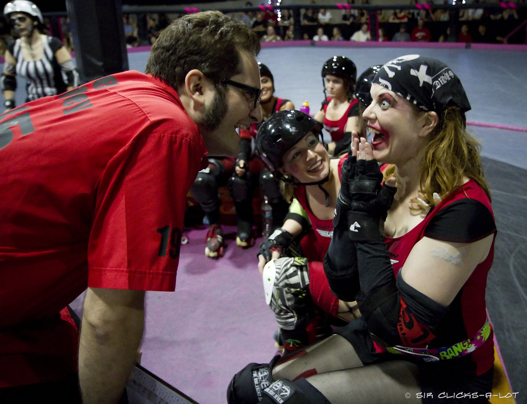 Coach relaying the results of the Official Review to the skater